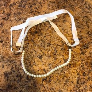 Pearl choker with white ribbon
